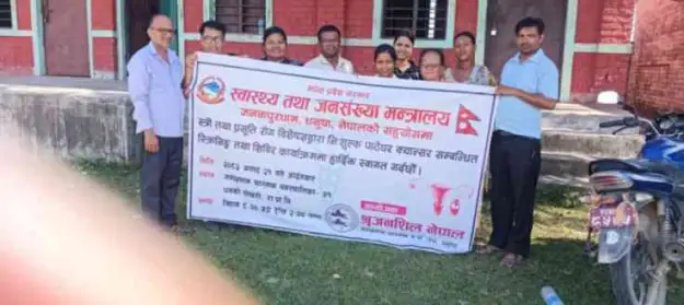 Shrijanshil Nepal team with the camp banner at Dhanki Pokhari Primary School