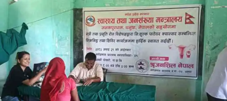 Women waiting and registering for screening inside the camp