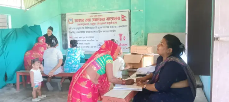 Specialist doctors examining and counselling women at the camp